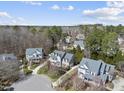 Picturesque neighborhood showcasing well-maintained homes, mature trees, and winding streets, providing a peaceful community setting at 318 Belles Landing Ct, Cary, NC 27519