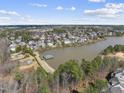 Scenic community featuring waterfront properties, lush greenery, and stunning lake views, perfect for nature enthusiasts at 318 Belles Landing Ct, Cary, NC 27519