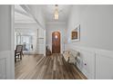Entryway boasts wood flooring, bench seating, and an elegant front door at 3805 Barberry Lake Ct, Fuquay Varina, NC 27526