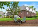 Picturesque backyard with cozy seating around a fire pit, perfect for outdoor relaxation and entertaining at 498 Mountain Laurel, Chapel Hill, NC 27517