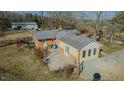 Aerial view showcases the home's backyard, concrete patio, and overall property layout at 5436 New Oak Trl, Burlington, NC 27217