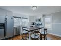Bright kitchen with stainless steel appliances, wood floors, and marble countertops at 5436 New Oak Trl, Burlington, NC 27217