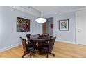 Dining room featuring a round wooden table with black leather chairs at 618 N Boylan Ave # 518, Raleigh, NC 27603
