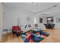 Comfortable living room with a curved white sofa and colorful rug at 618 N Boylan Ave # 518, Raleigh, NC 27603