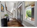 Grand entryway boasts hardwood floors, staircase, and natural light at 766 Horizon Dr, Pittsboro, NC 27312