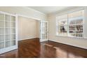 Bright office space with rich hardwood floors, natural light, and french doors at 8008 Hergety Dr, Raleigh, NC 27603