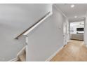 Bright entryway showcasing hardwood floors and a staircase leading to the upper level at 90 Rigsby Ave, Four Oaks, NC 27524