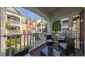 Relaxing outdoor patio featuring stylish furniture and a charming view of the neighborhood's inviting architecture at 9211 Calabria Dr # 117, Raleigh, NC 27617