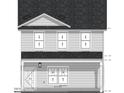 Two-story home showcasing symmetrical design, light siding, and dark roof at 1117 S Blount St, Raleigh, NC 27601