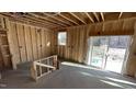 Unfinished garage space ready for customization with window and sliding door at 140 Gobbler Dr, Smithfield, NC 27577