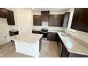 Bright kitchen boasts granite counters, an island and stainless steel appliances at 140 Gobbler Dr, Smithfield, NC 27577