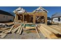New home construction site showing framing and materials, ready for further development at 140 W Saltgrass Ln, Smithfield, NC 27577