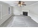 Spacious living room with a cozy fireplace and neutral carpeting, creating a blank canvas for personalization at 143 George Wilton Dr, Clayton, NC 27520