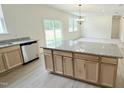 Bright kitchen featuring granite countertops, stainless steel appliances, and a large island at 158 Gobbler Dr, Smithfield, NC 27577