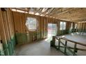Spacious living room featuring a sliding glass door and several windows for natural light at 158 Gobbler Dr, Smithfield, NC 27577