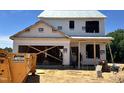 New construction home's exterior view showcasing the two-story layout in the process of being built at 183 W Saltgrass Ln, Smithfield, NC 27577