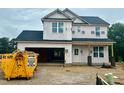 New construction home featuring a modern design and a spacious two-car garage in a residential neighborhood at 189 W Saltgrass Ln, Smithfield, NC 27577