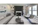Elegant living room featuring a fireplace, built-in bookshelves and neutral decor at 197 W Saltgrass Ln, Smithfield, NC 27577