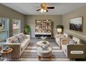 Bright living room featuring modern furnishings, stylish decor, and hardwood floors at 2412 Little John Rd, Raleigh, NC 27610
