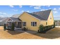 The home has a screened-in porch and patio with outdoor seating on a landscaped lot at 2500 Plowridge Rd, Fuquay Varina, NC 27526