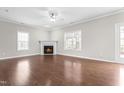 Bright living room boasts hardwood floors, a fireplace, and abundant natural light at 314 Star Ruby Dr, Knightdale, NC 27545