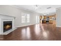 Open-concept living area with fireplace seamlessly connects to the kitchen at 314 Star Ruby Dr, Knightdale, NC 27545