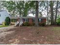 Charming brick ranch with covered parking and front yard at 3429 Dogwood Dr, Raleigh, NC 27604