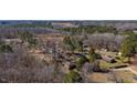 An aerial view showcasing the property's location, surrounded by lush trees and the neighborhood at 4018 Kilkenny Ave, Oxford, NC 27565