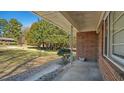A brick porch with patterned posts; an ideal spot for relaxing while enjoying the outdoors at 4018 Kilkenny Ave, Oxford, NC 27565