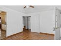 This bedroom has wood floors, and an open closet off to the side at 415 Cherry St, Oxford, NC 27565