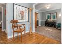 Inviting foyer with hardwood floors, stylish decor, and an open view to the living area at 4617 Atterbury Ct, Raleigh, NC 27604