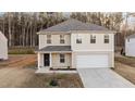 Charming two-story home with a covered entryway and an attached garage at 538 E Waycliff Rd, Henderson, NC 27537