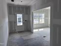 Spacious entryway area with a glass door and a large window showing the outside view at 548 Jocund St # 15, Rolesville, NC 27571