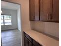 Partial kitchen view leading into the dining room, highlighting counter space and cabinetry at 548 Jocund St # 15, Rolesville, NC 27571