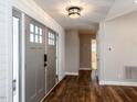 Welcoming entryway featuring hardwood floors and stylish lighting at 5715 Sky Lane Dr, Durham, NC 27704