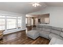 Open living room with large windows and hardwood floors at 5715 Sky Lane Dr, Durham, NC 27704