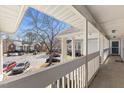 View from balcony showing parking lot, trees, and other buildings at 723 Renshaw Ct, Cary, NC 27518