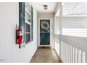 A white door with a wreath and glass in a small entryway at 723 Renshaw Ct, Cary, NC 27518