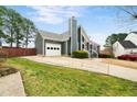 View of the house from the side showing driveway and garage at 809 Handel Ln, Apex, NC 27502