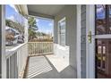 Inviting covered front porch, perfect for relaxing and enjoying the neighborhood views at 8310 Hempshire Pl # 106, Raleigh, NC 27613