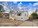 A charming one-story home with a brick chimney and freshly painted white exterior at 916 Tyan St St, Rocky Mount, NC 27801