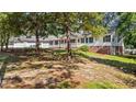 Ranch-style house with a three-car garage and a well-kept lawn at 98 Beach Ln, Henderson, NC 27537