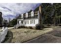 Attractive two-story home featuring dormer windows and a brick chimney at 104 Province Cir, Rocky Mount, NC 27804