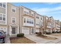 Charming multi-level townhomes with attached garages, manicured lawns, and inviting curb appeal at 110 Darley Dale Loop, Apex, NC 27502