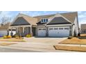 Charming home with a two-car garage and a spacious driveway at 1605 Orange Tip St, Fuquay Varina, NC 27526