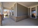 Inviting front porch with brick accents and direct access to the front door at 1605 Orange Tip St, Fuquay Varina, NC 27526