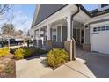 Inviting front porch with brick accents and well-maintained landscaping at 1605 Orange Tip St, Fuquay Varina, NC 27526