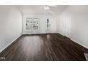 Open living space with vaulted ceilings and luxury vinyl flooring, creating a bright and spacious atmosphere at 20 Beechnut Ct, Franklinton, NC 27525