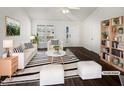 Bright living room boasts neutral colors and vaulted ceilings, showcasing a modern aesthetic, virtually staged at 20 Beechnut Ct, Franklinton, NC 27525