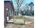 Newly constructed deck on a brick house, overlooking the street at 201 W Thorndale Dr, Oxford, NC 27565